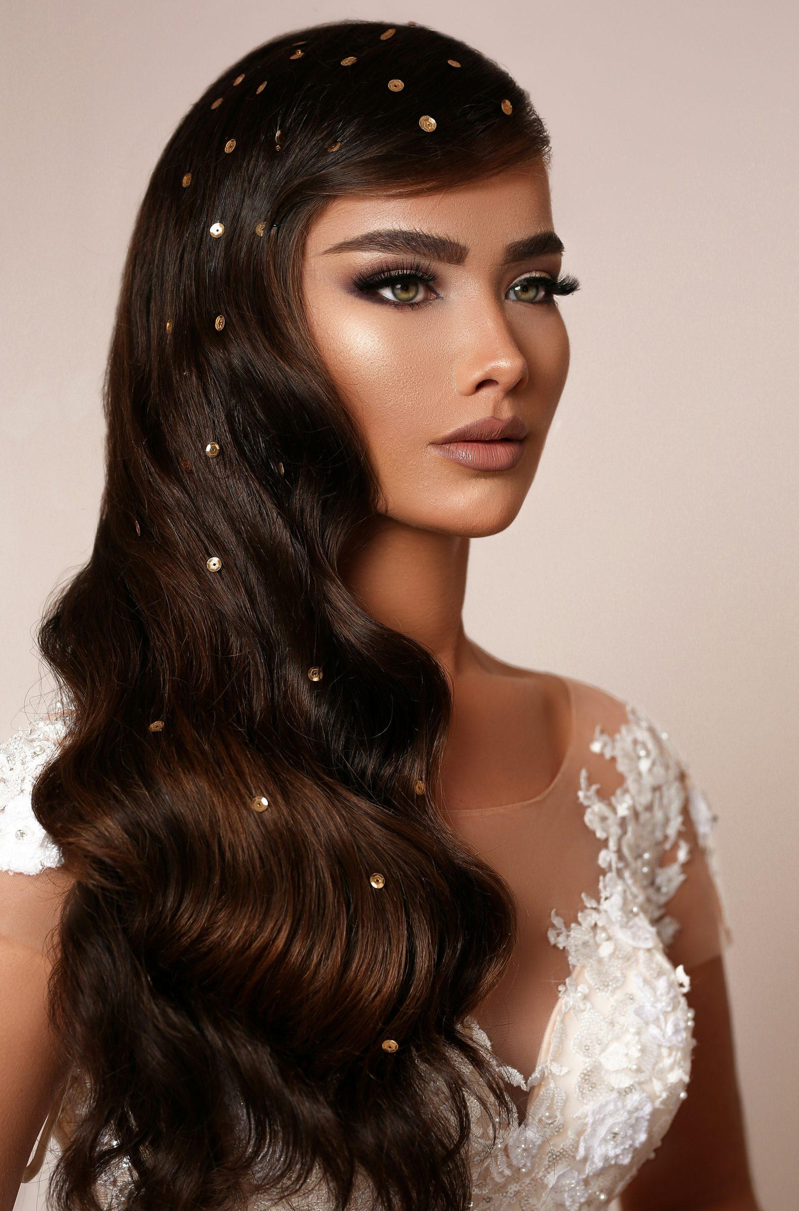 Glamorous bridal makeup with luminous skin and soft waves