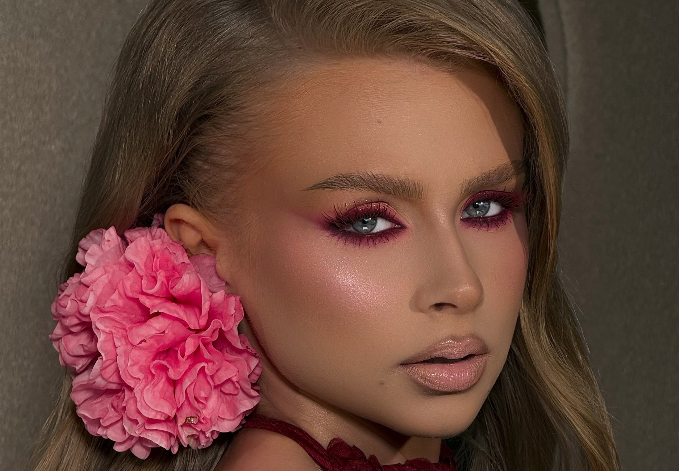 Bold, luminous occasion glam makeup with a warm glow