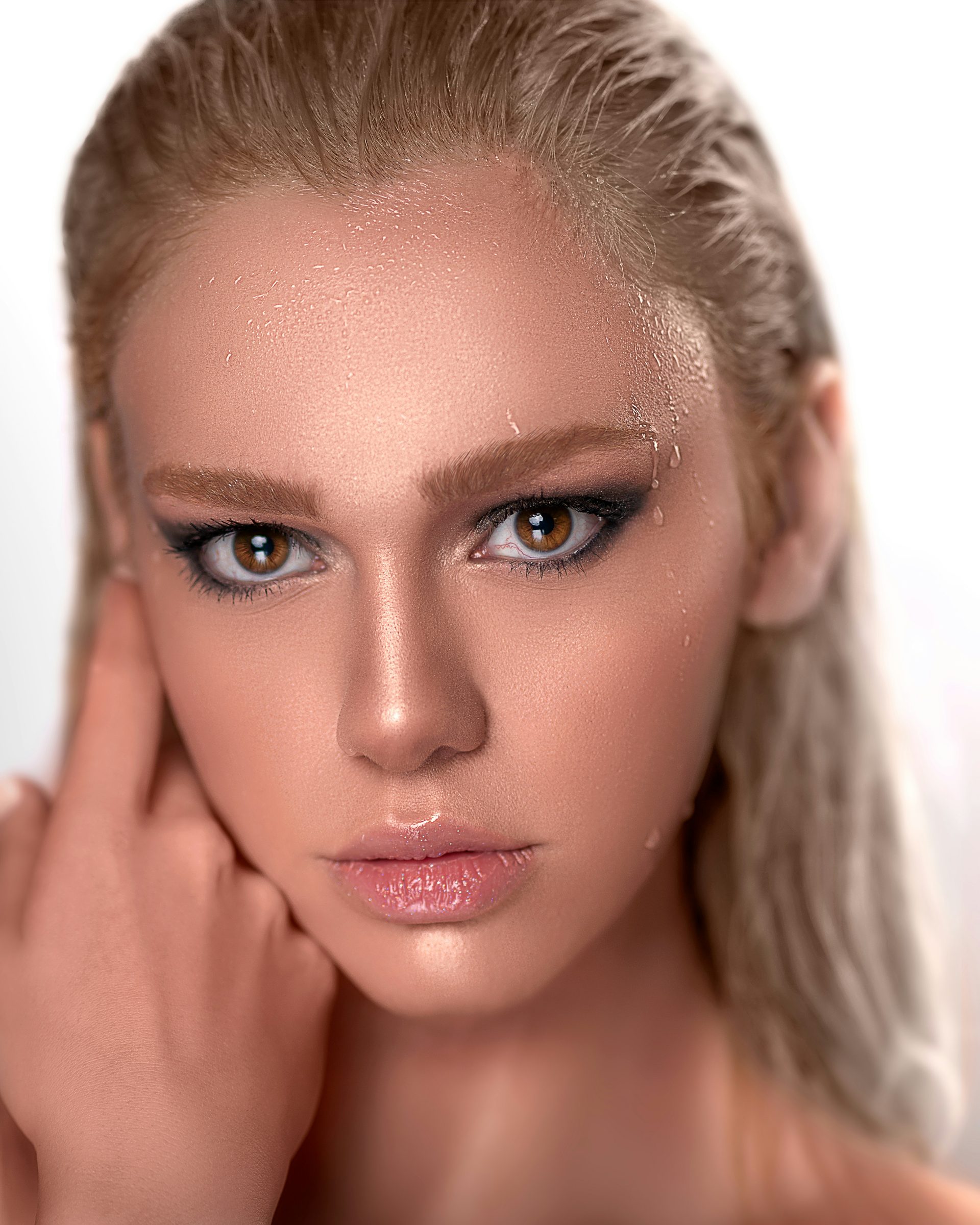 Bold, luminous occasion glam makeup with a warm glow